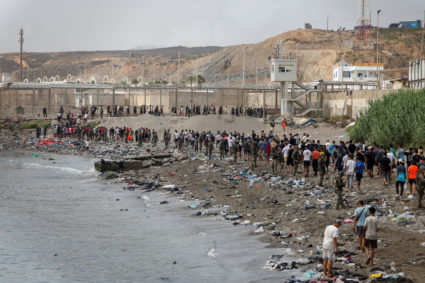 Migrants cross into the Spanish enclave of Ceuta