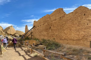 Tourists view Pueblo Bonito, one of a series of Puebloan structures in Chaco Canyon