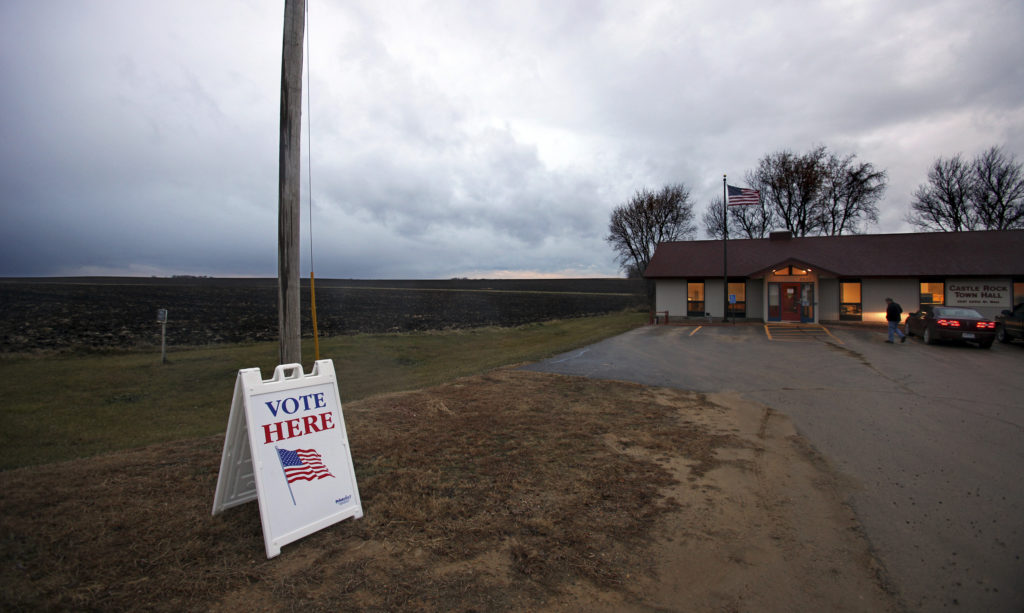 A man enters the Castle Rock Town Hall to vote in Minnesota