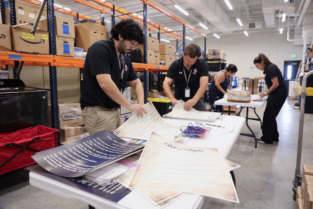 Hays Consolidated Independent School District employees prepare Bill of Rights posters in Kyle