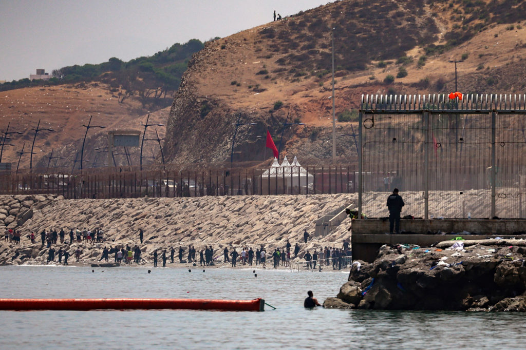 Mass crossings of migrants on foot and by sea from Morocco into Spanish territory, in Ceuta