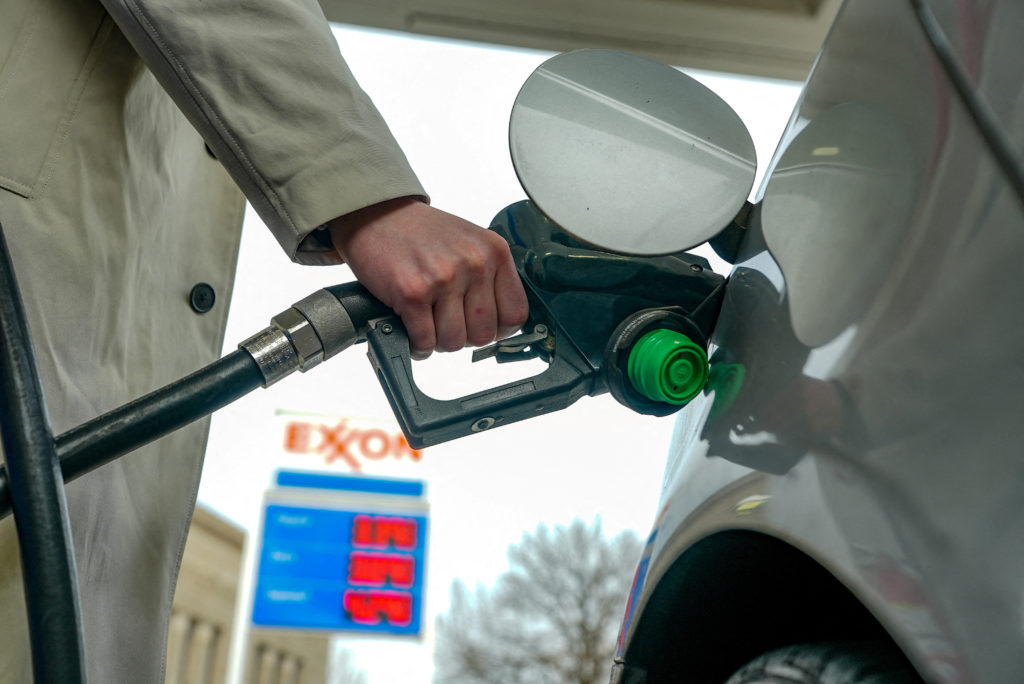 FILE PHOTO: Gas prices are seen at a fuelling station as the price of oil and gas has surged amid the U.S.-Israeli conflic...