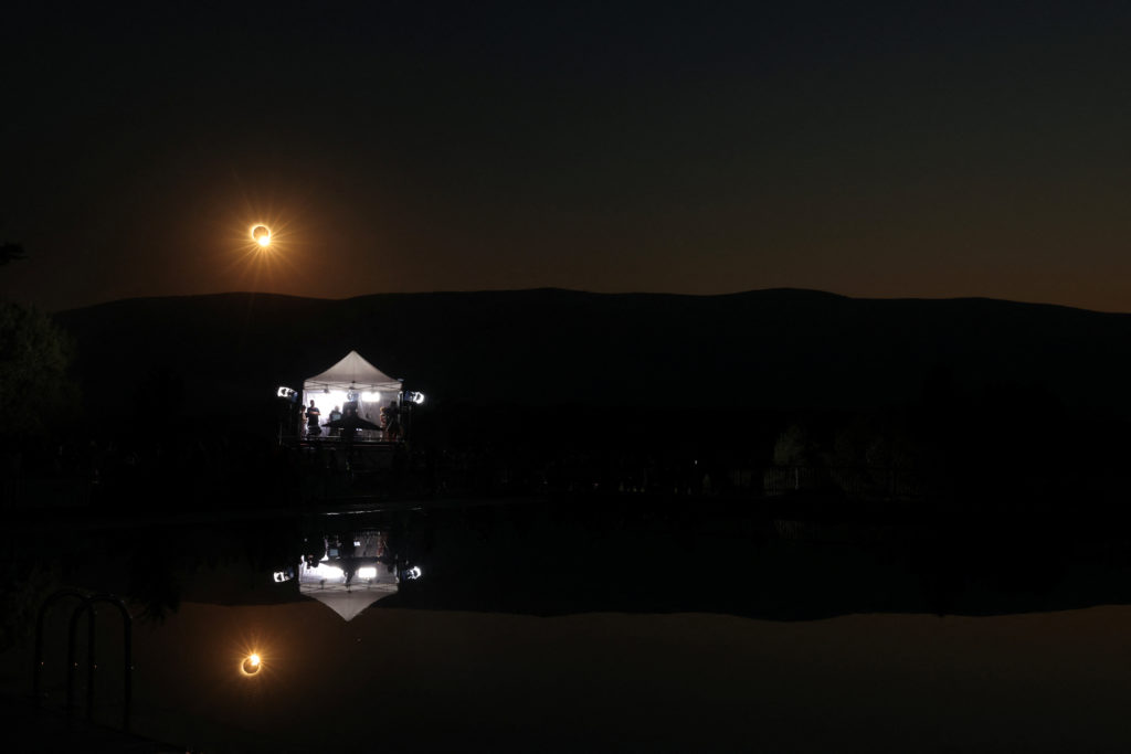 The moon partially covers the sun after reaching totality on the day of a total solar eclipse in Buitrago del Lozoya