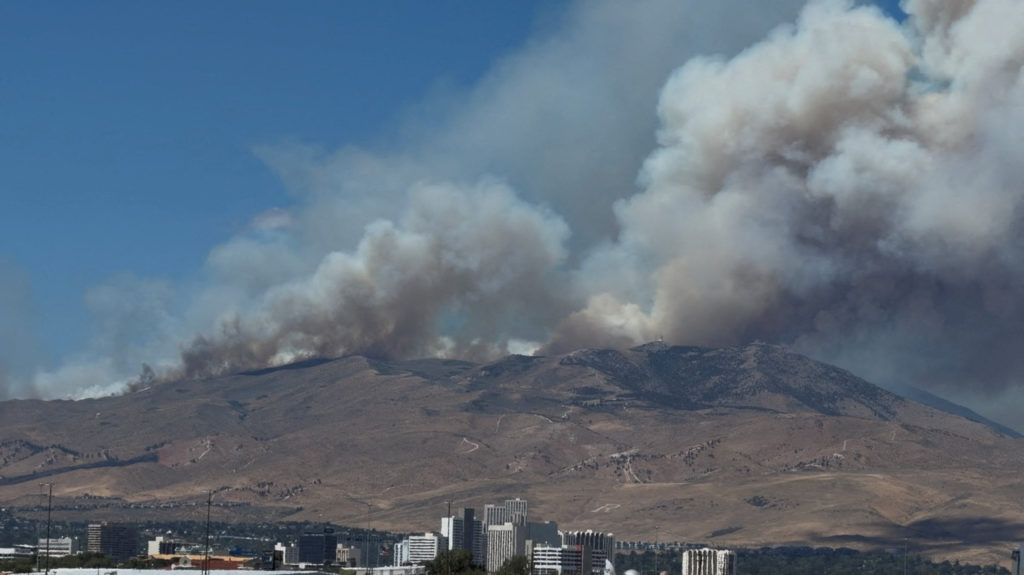 Human-caused wildfire approaches Reno, Nevada, forcing thousands of evacuations