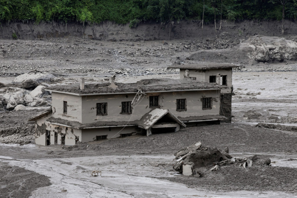 A mud-covered building following a flash flood at Trishuli, Nepal