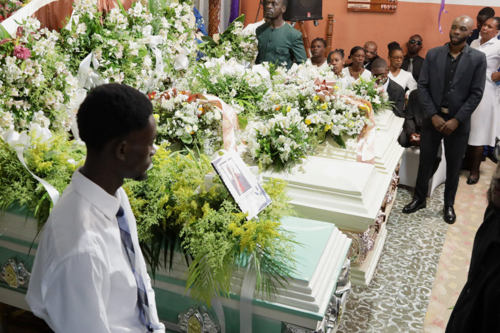 Hundreds attend funeral in Haiti for 4 victims of brutal gang attack that killed 47