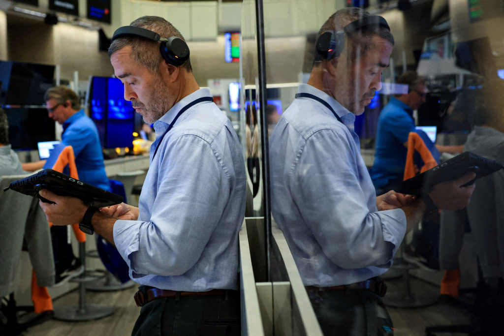 Stocks slip on Wall Street under pressure from rising oil prices, bond sell-off