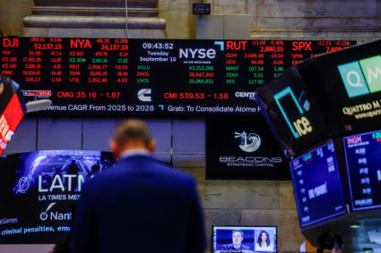 A screen displays stock market information after the opening bell at the New York Stock Exchange (NYSE) in New York City
