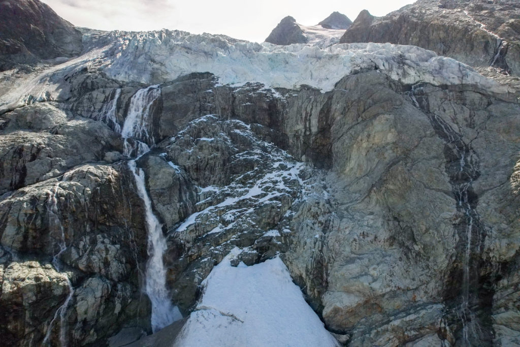 FILE PHOTO: A drone view shows meltwater cascading down the Mont Mine glacier near Evolene