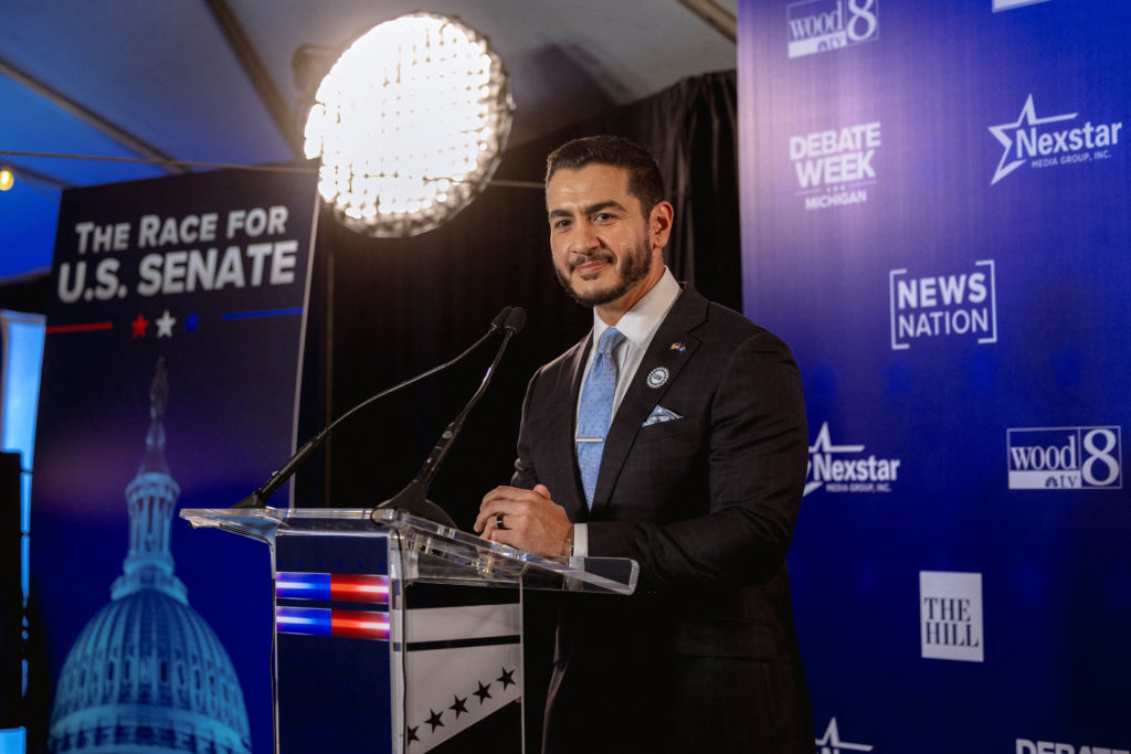 Democratic US Senate candidate Abdul El-Sayed and his Republican rival Mike Rogers take part in a debate in Grand Rapids, ...