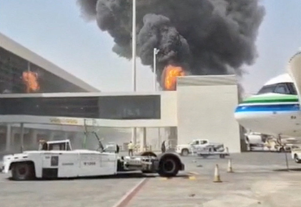 Smoke and flames rise from King Khalid Airport, after Yemen's Iran-backed Houthis said they attacked the airport, in Riyadh