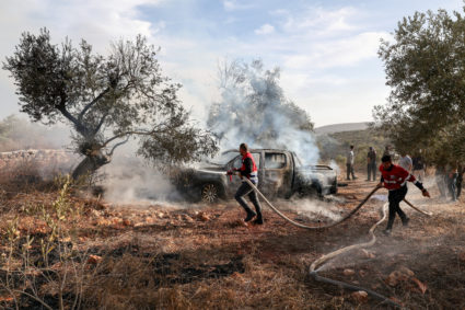 Israeli settlers attack Palestinians during West Bank olive harvest and beat U.S. photojournalist