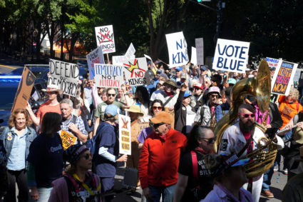 "No Kings" protest as part of a nationwide day of action aimed at encouraging early voting ahead of the midterm elections ...