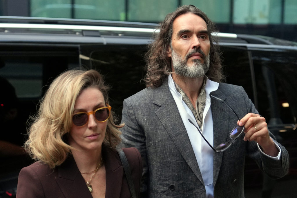 Russell Brand appears in London court for trial on rape and sexual assault charges